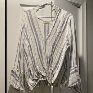 Plus size top with belle sleeves.